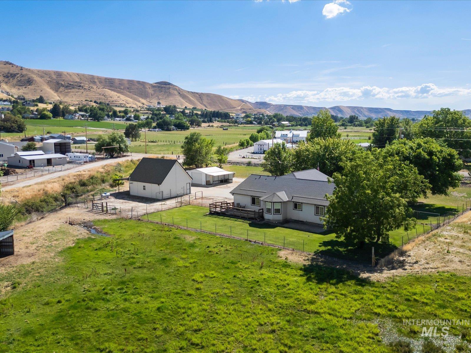 3540 Wills Road Emmett, ID 83617 - Photo 35 of 36 Aerial perspective showcasing the primary residence, a detached auxiliary building, and expansive green spaces