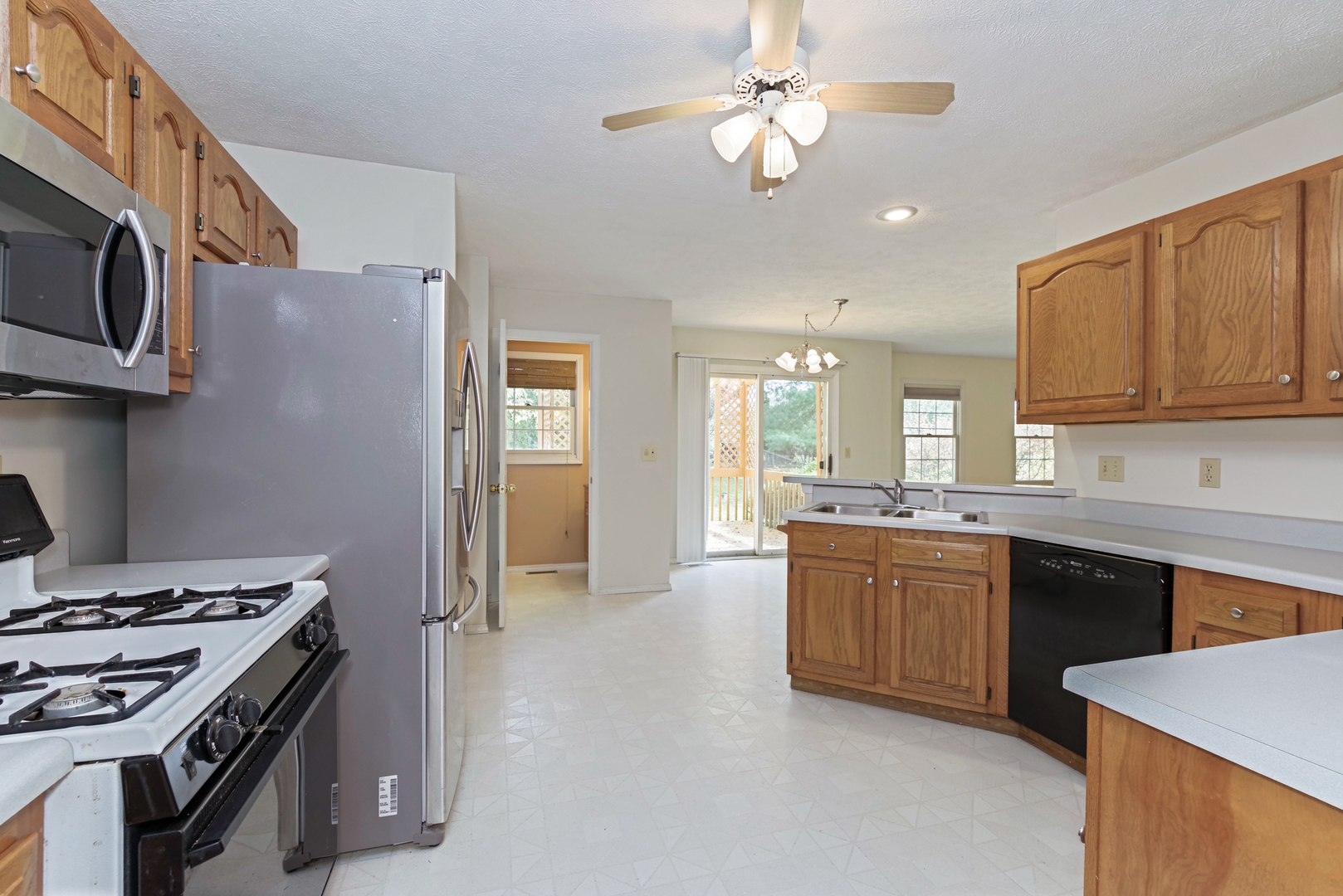 116 North Blair Drive Normal, IL 61761 - Photo 15 of 41 a kitchen with stainless steel appliances granite countertop a stove a sink dishwasher and a refrigerator