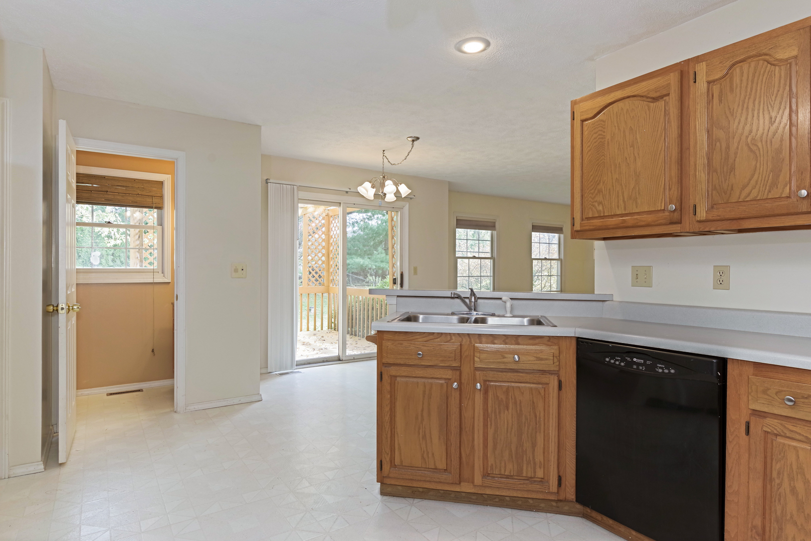 116 North Blair Drive Normal, IL 61761 - Photo 16 of 41 a kitchen with granite countertop a sink and cabinets
