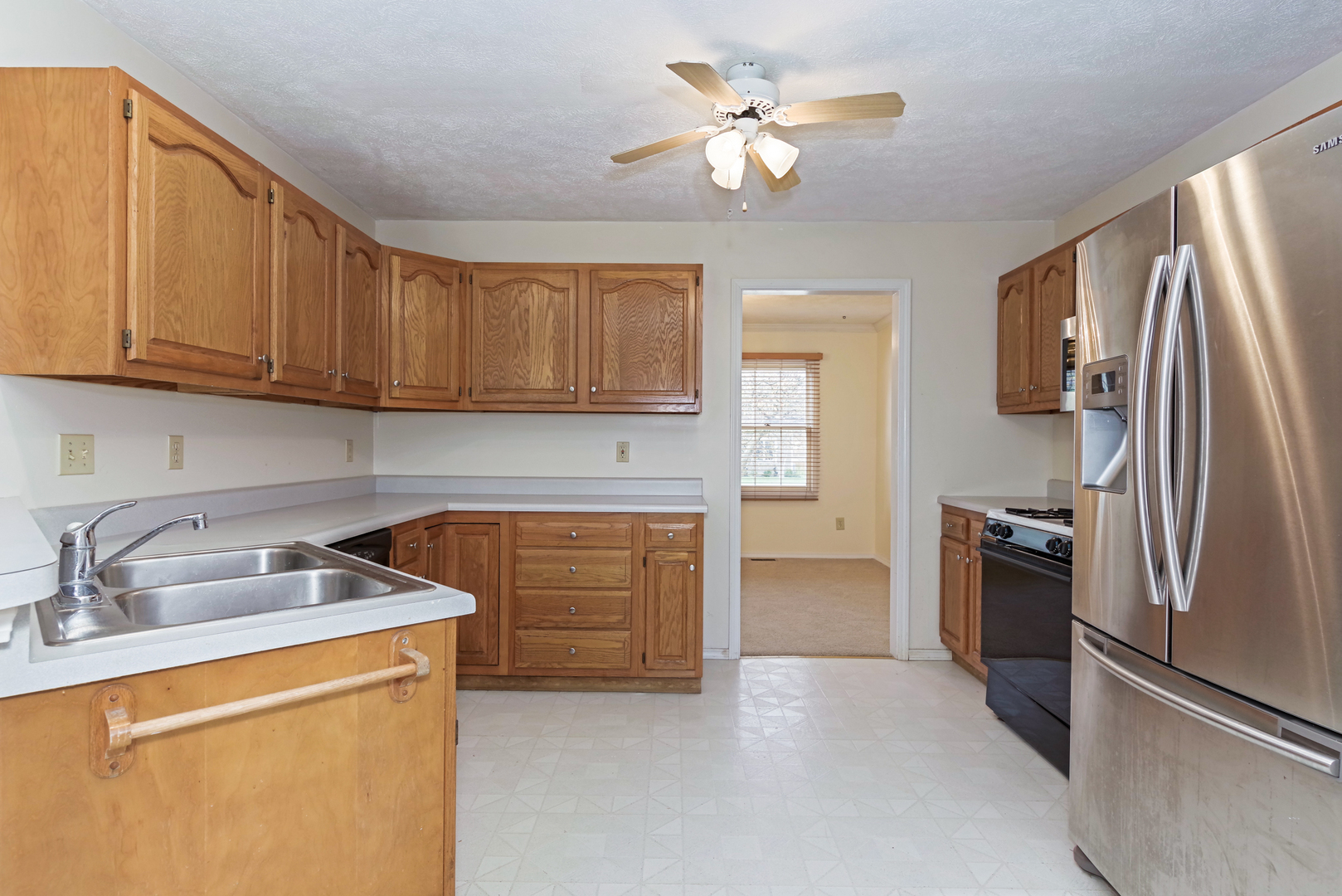 116 North Blair Drive Normal, IL 61761 - Photo 17 of 41 a kitchen with stainless steel appliances granite countertop a refrigerator a stove and a sink