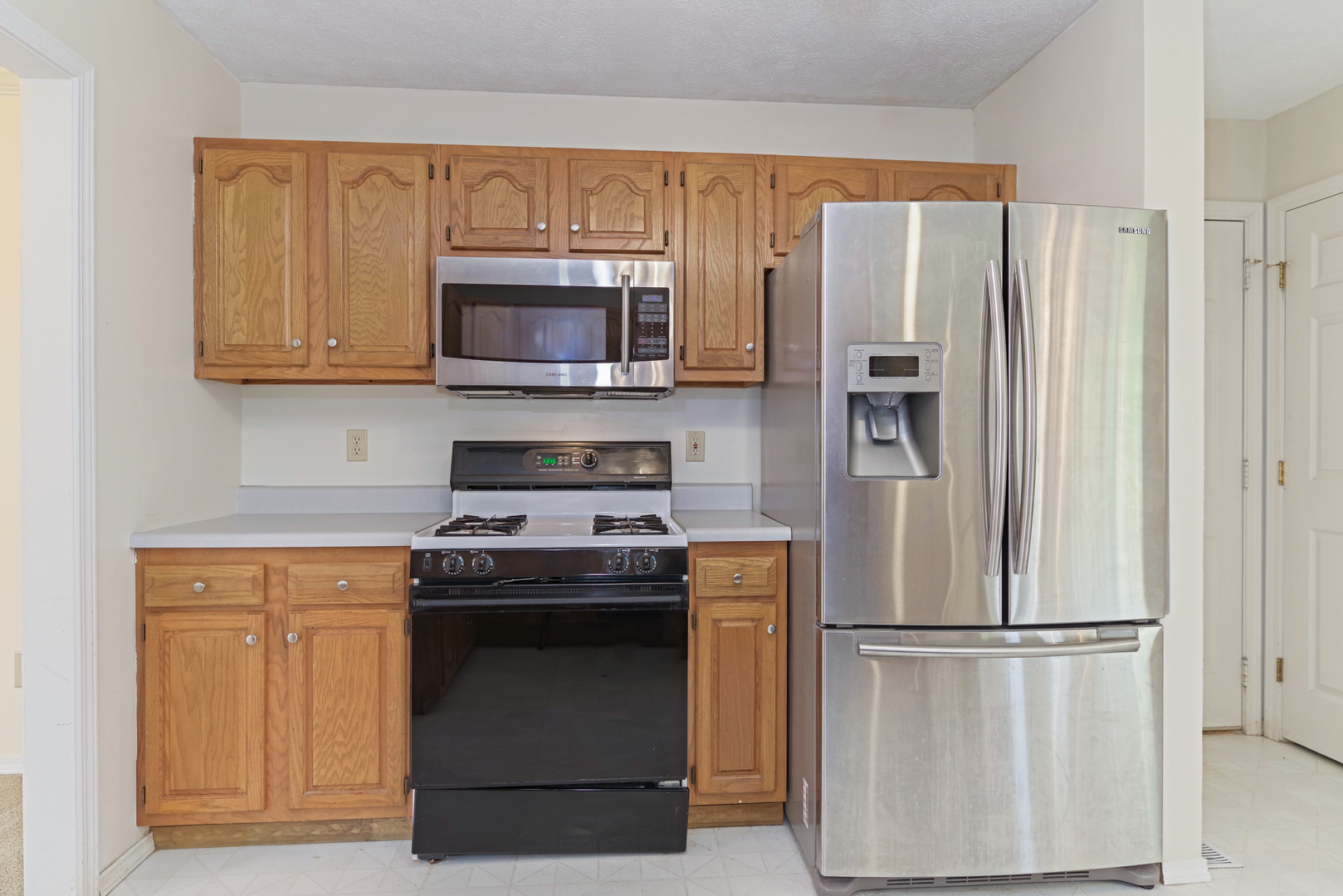 116 North Blair Drive Normal, IL 61761 - Photo 18 of 41 a kitchen with a refrigerator stove and microwave