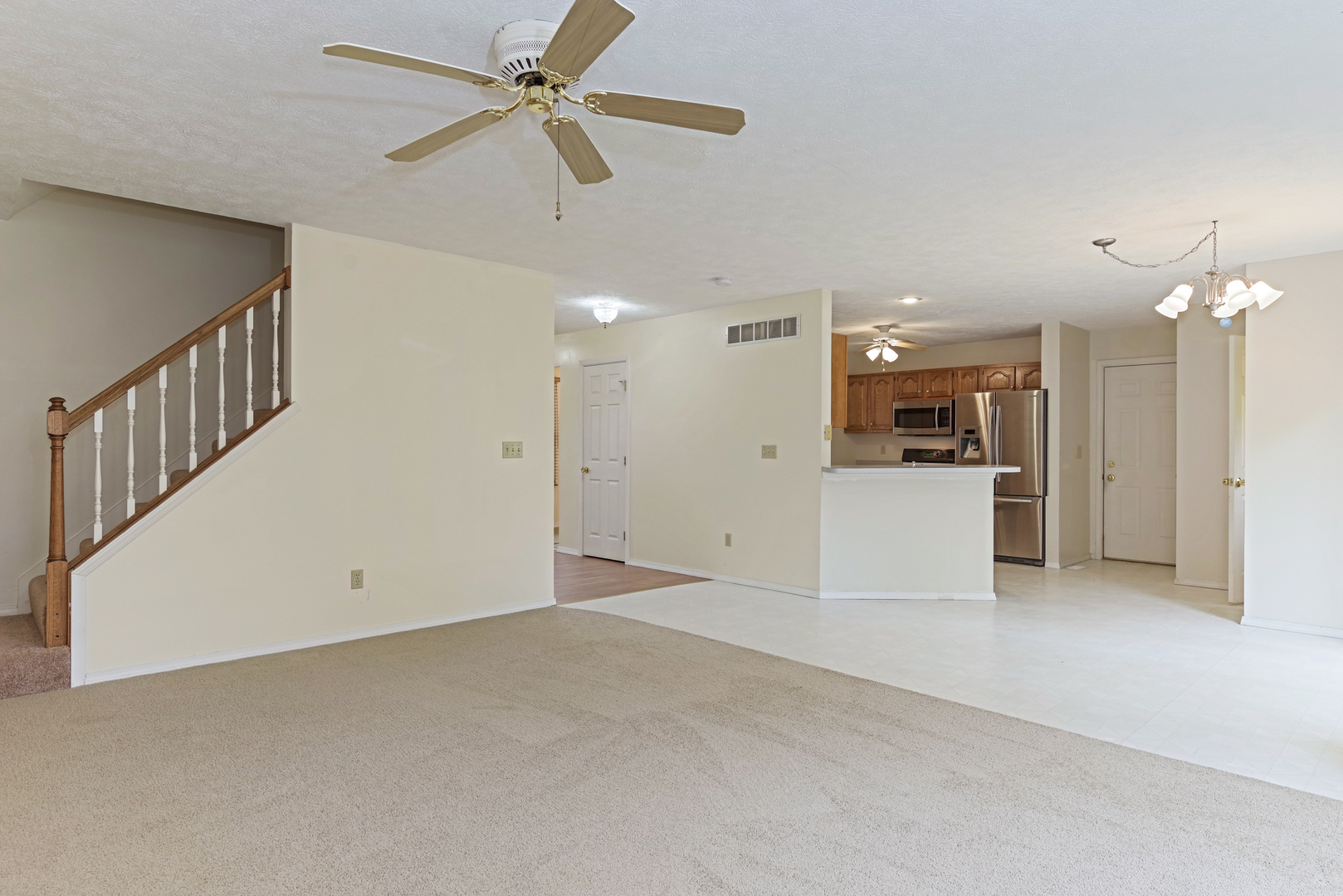 116 North Blair Drive Normal, IL 61761 - Photo 24 of 41 a view of a livingroom with kitchen appliances and a ceiling fan