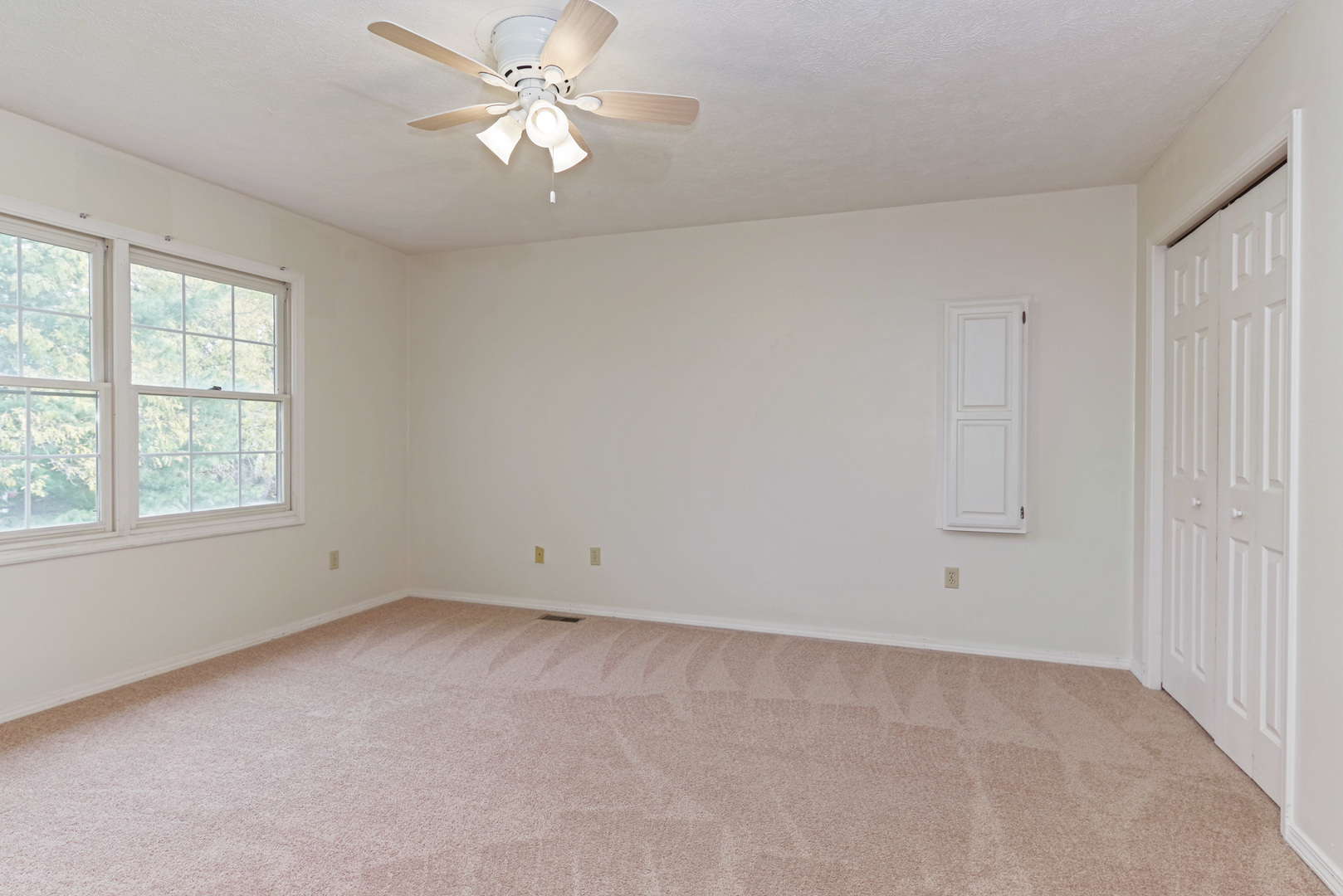 116 North Blair Drive Normal, IL 61761 - Photo 26 of 41 an empty room with a window and a fan