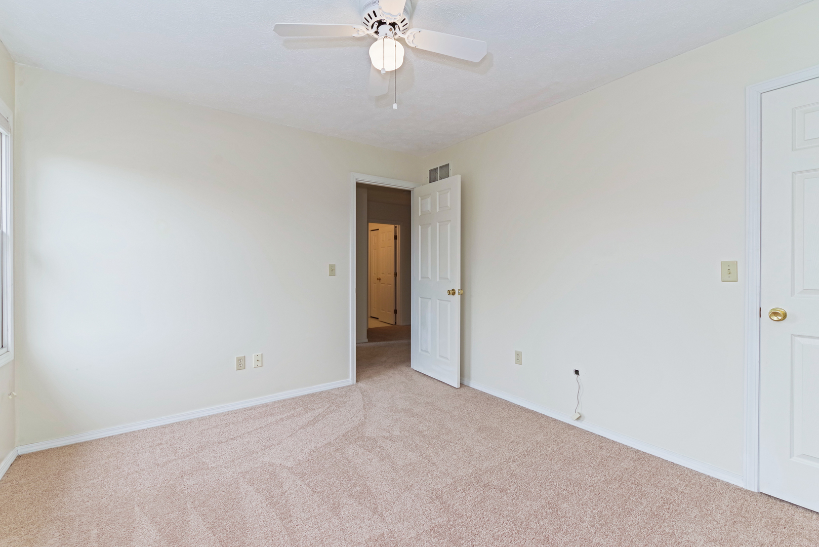 116 North Blair Drive Normal, IL 61761 - Photo 34 of 41 an empty room with a ceiling fan and a window