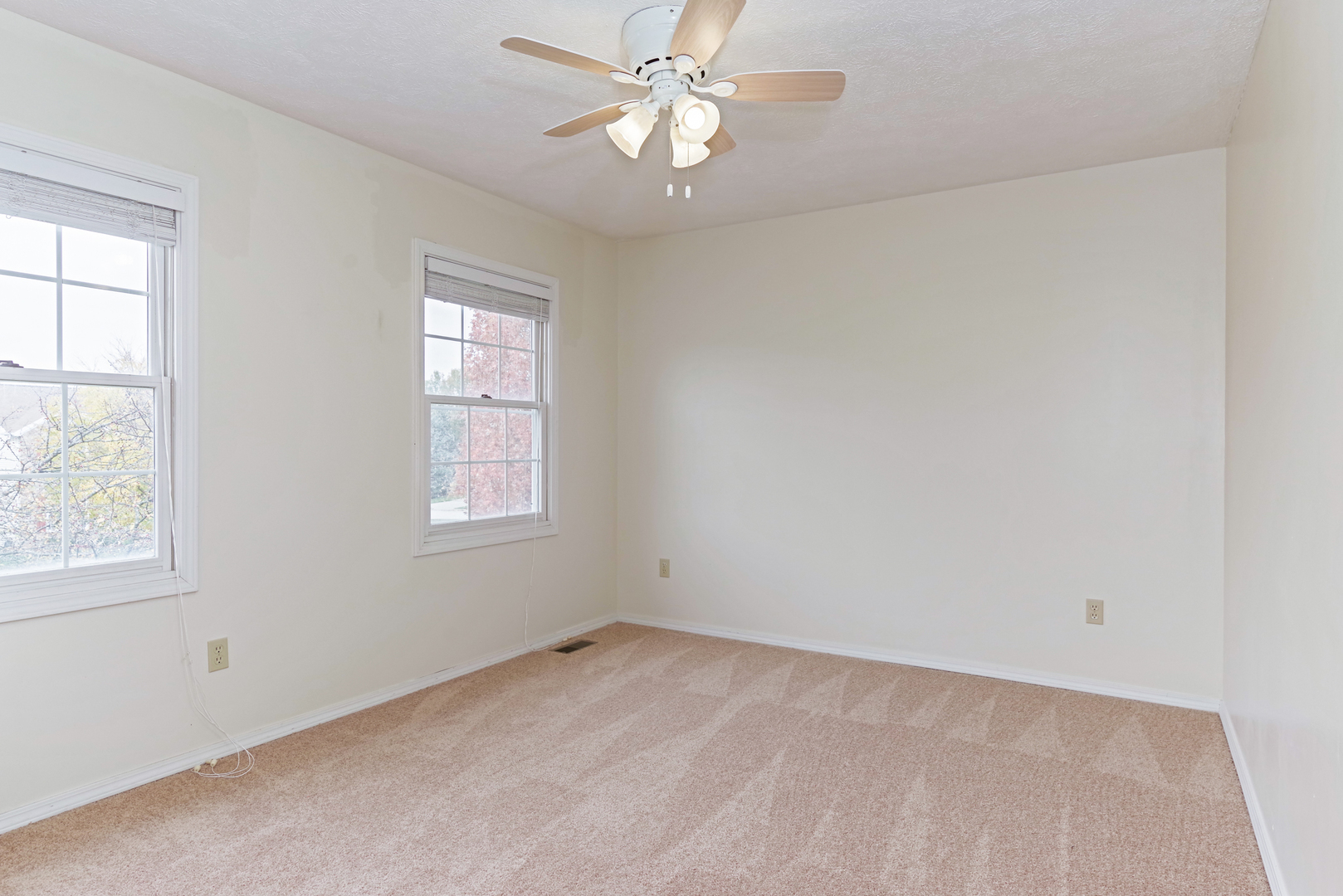 116 North Blair Drive Normal, IL 61761 - Photo 35 of 41 an empty room with a window and a fan
