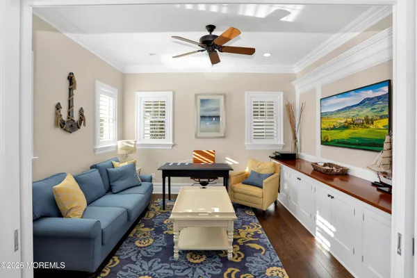a living room with furniture kitchen view and a fireplace