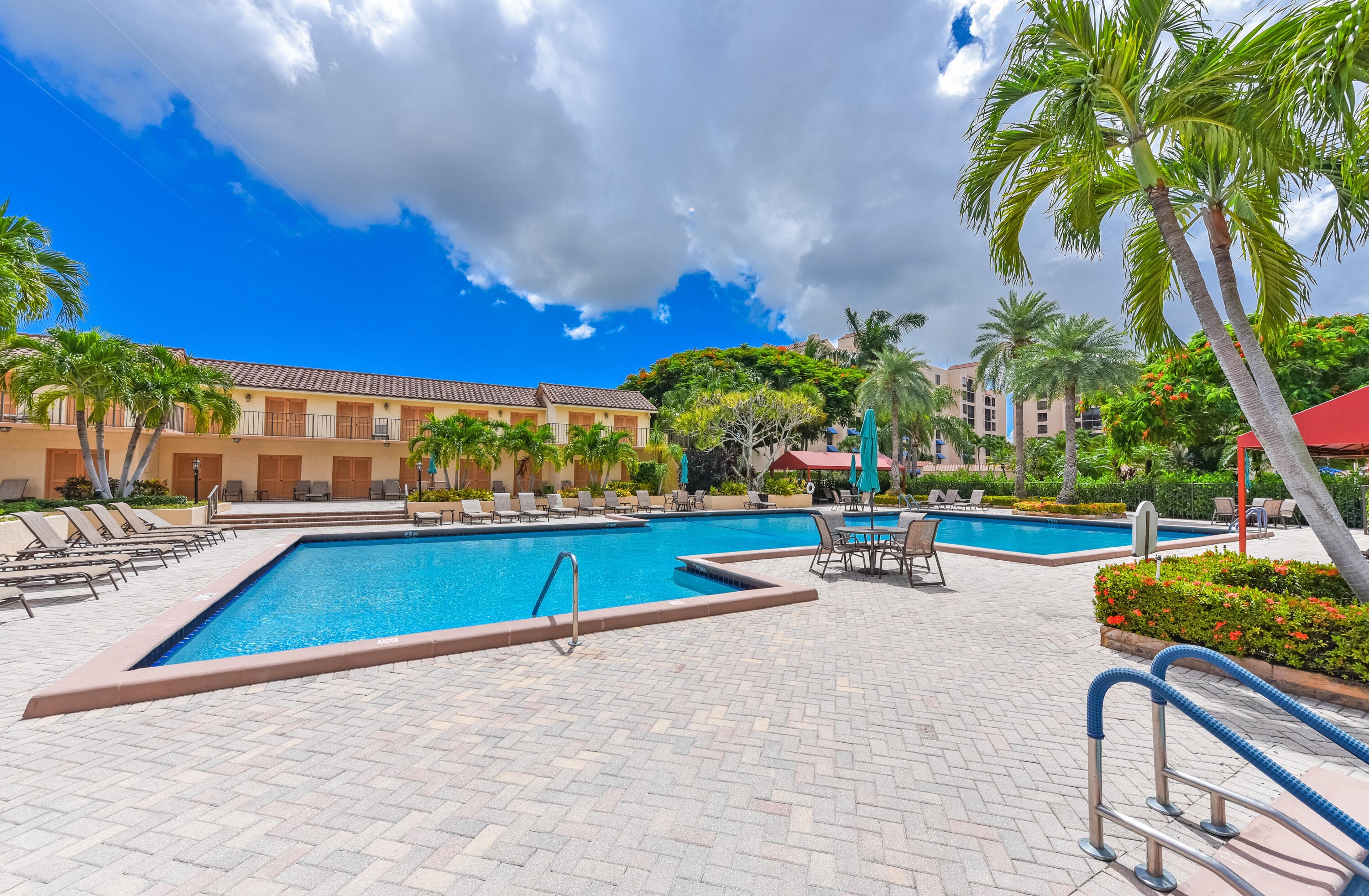 7145 Promenade Drive, Unit 101 Boca Raton, FL 33433 - Photo 20 of 24 a view of a swimming pool with a lounge chairs