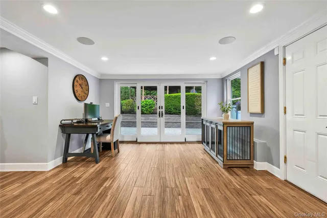 a view of a livingroom with furniture wooden floor and window