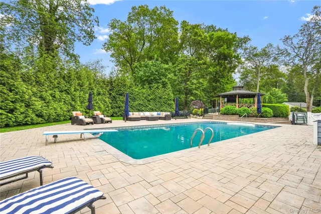 a view of a swimming pool with a lounge chair