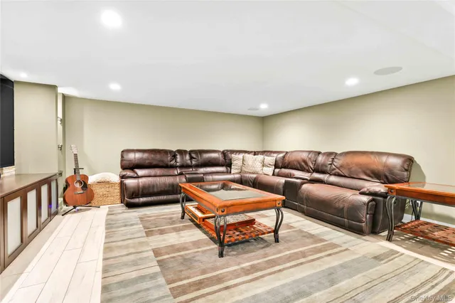 a living room with a couch and a wooden floor