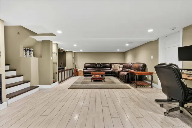 a bed room with furniture and a wooden floor