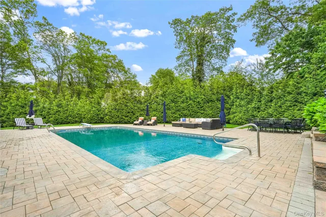 a view of a swimming pool with a backyard