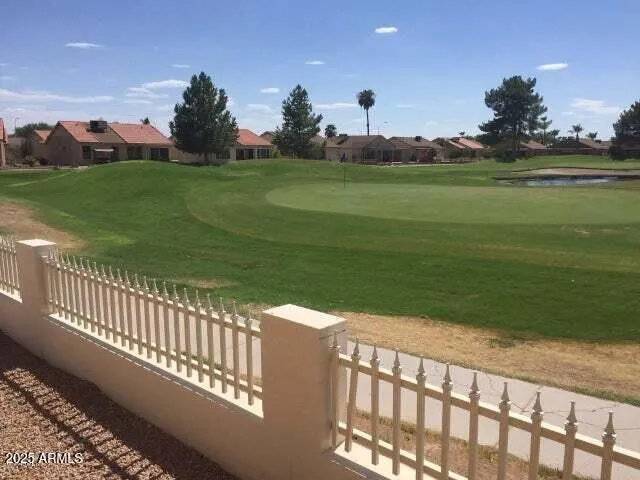 a view of a golf course with a lake