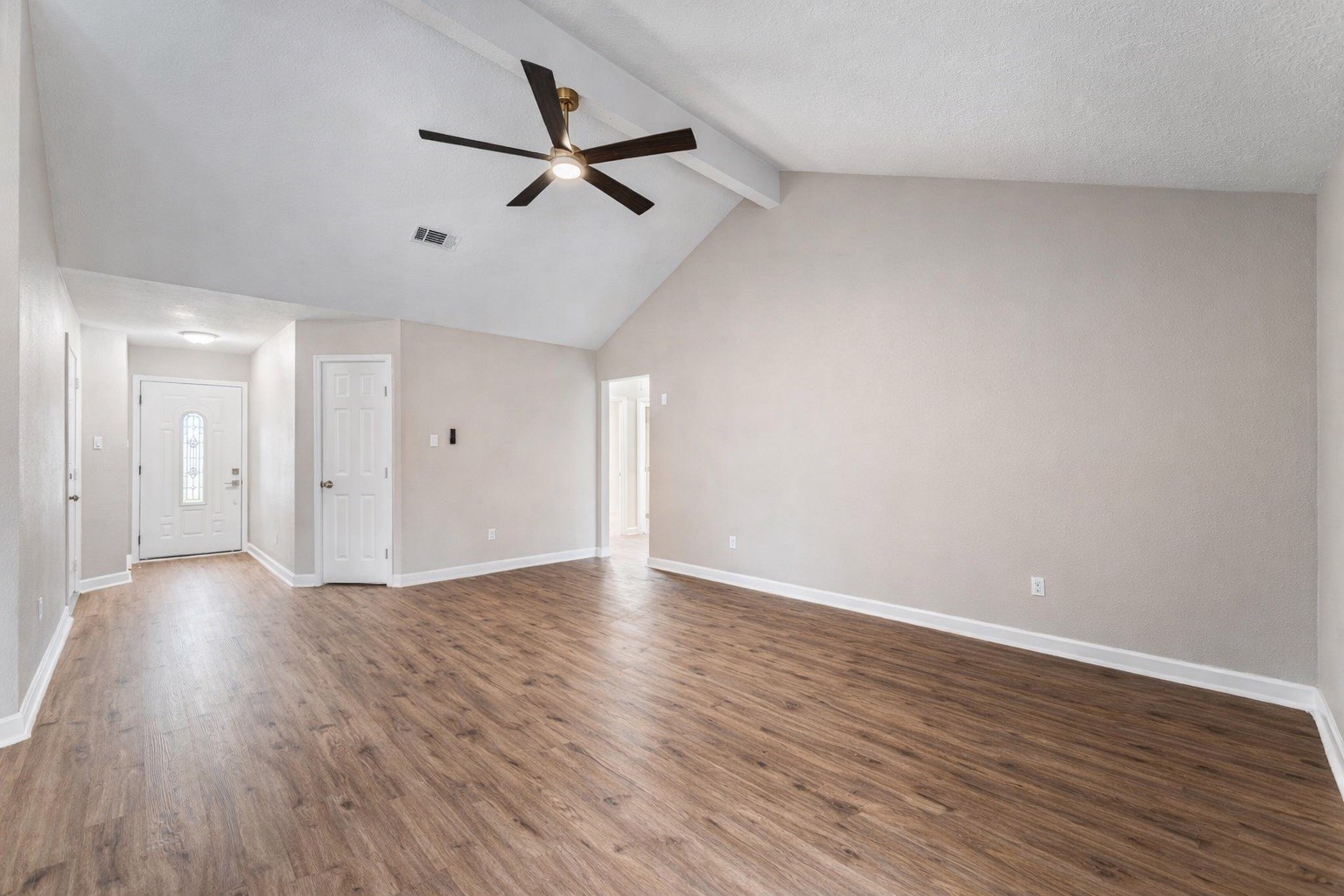 19711 Bishops Gate Lane Humble, TX 77338 - Photo 4 of 12 Bright, flexible living space that connects seamlessly to the kitchen and entry.