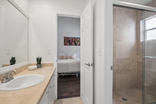 a en suite bathroom with a sink and a mirror