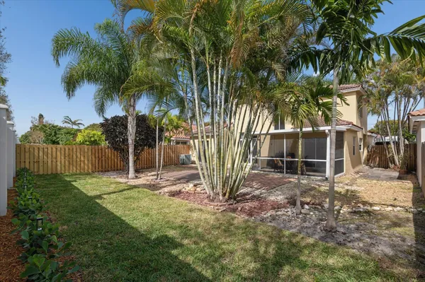 a backyard of a house with lots of green space