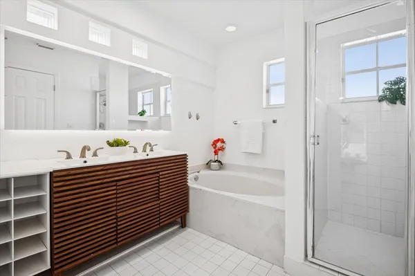 a bathroom with a bathtub and a sink