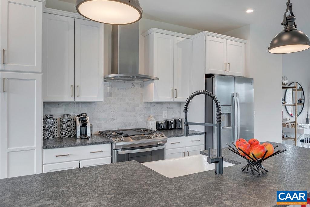 3199 Horizon Road Charlottesville, VA 22902 - Photo 11 of 27 a kitchen with stainless steel appliances kitchen island granite countertop a sink a stove and cabinets