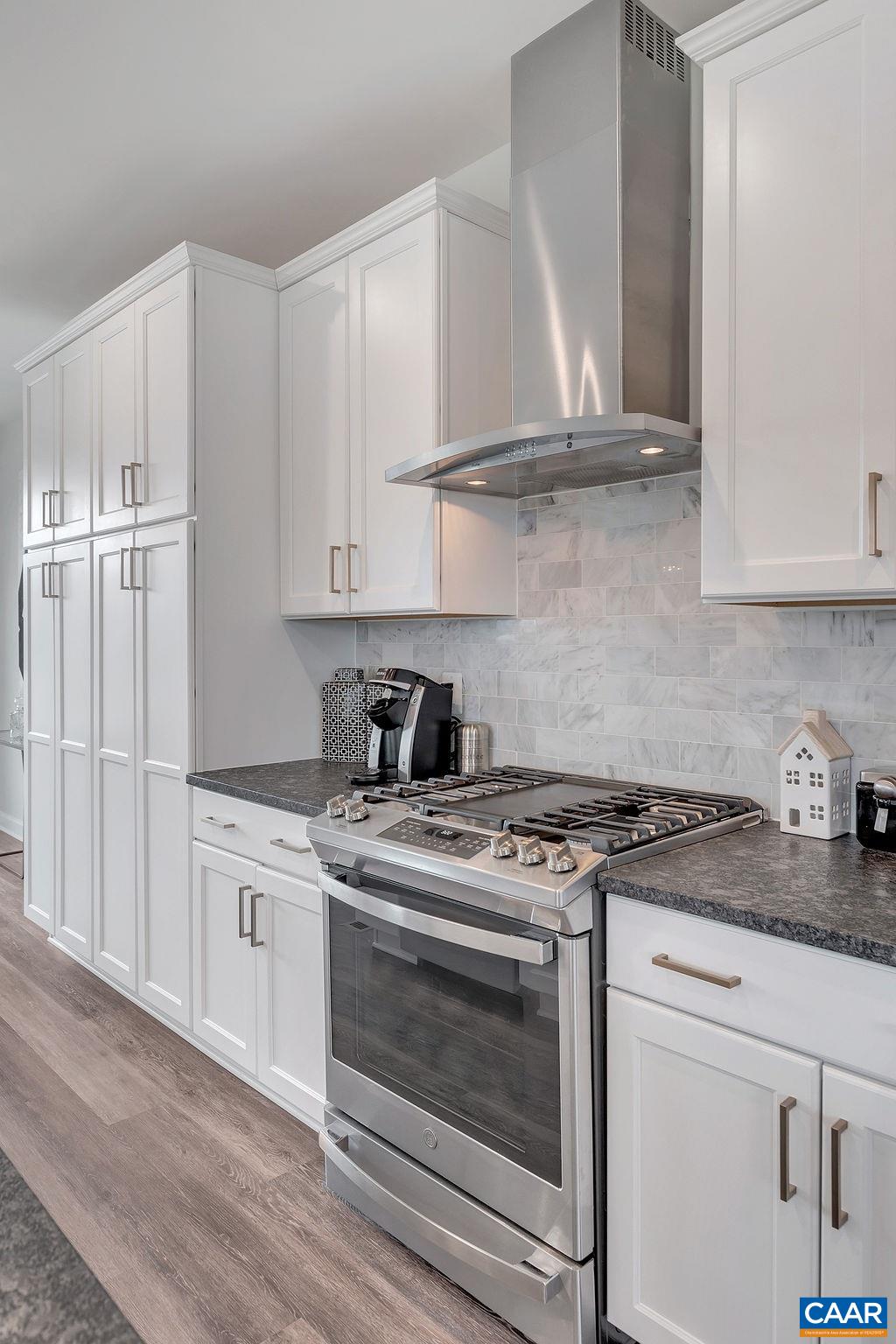 3199 Horizon Road Charlottesville, VA 22902 - Photo 13 of 27 a kitchen with granite countertop white cabinets and white stove