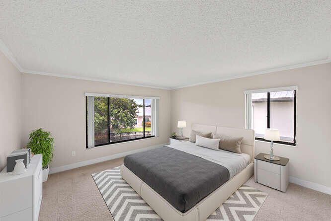 Undisclosed Address Stuart, FL 34994 - Photo 11 of 41 a bedroom with a large bed and a window