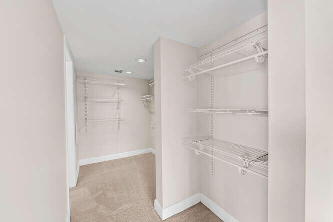 Undisclosed Address Stuart, FL 34994 - Photo 12 of 41 a view of an empty walk in closet