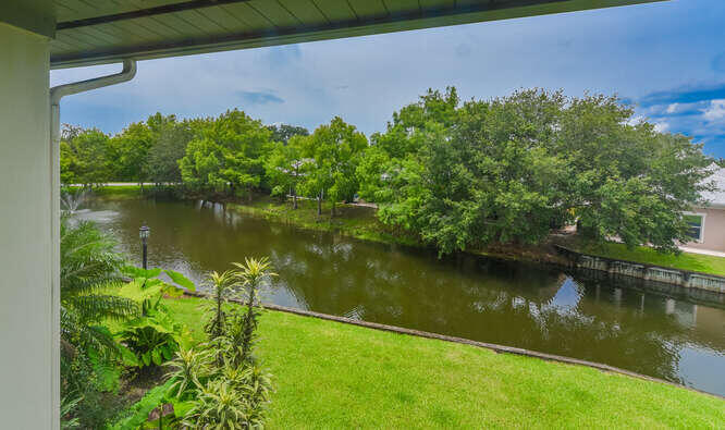 Undisclosed Address Stuart, FL 34994 - Photo 21 of 41 a view of a lake with a building in the background