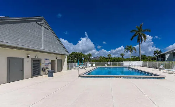 a view of a swimming pool with a patio