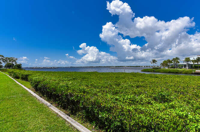 Undisclosed Address Stuart, FL 34994 - Photo 26 of 41 a view of a lake with a yard