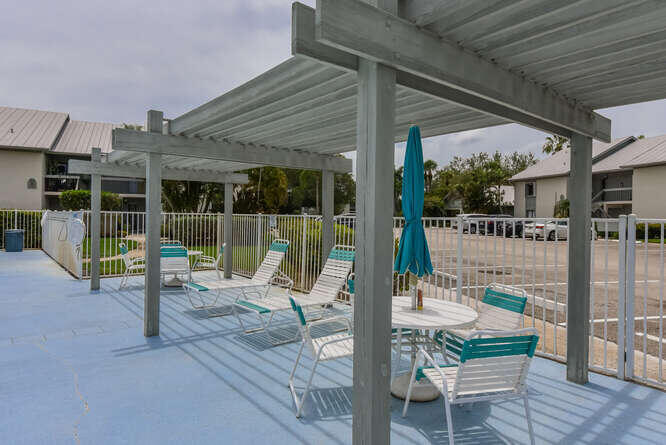 Undisclosed Address Stuart, FL 34994 - Photo 35 of 41 a view of a patio with couches chairs and a wooden floor