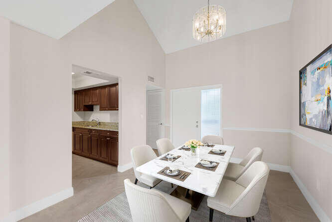 Undisclosed Address Stuart, FL 34994 - Photo 4 of 41 a open dining room with furniture and window