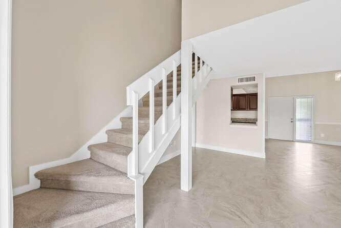 Undisclosed Address Stuart, FL 34994 - Photo 5 of 41 a view of an entryway with wooden floor