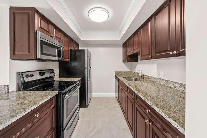 Undisclosed Address Stuart, FL 34994 - Photo 6 of 41 a kitchen with stainless steel appliances granite countertop a kitchen island a stove and a sink