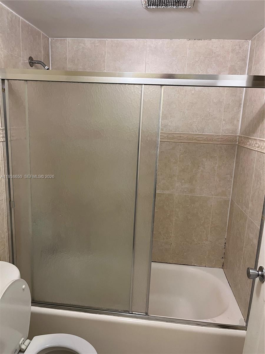 15630 Southwest 80th Street, Unit I110 Miami, FL 33193 - Photo 14 of 28 a bathroom with a shower and a sink