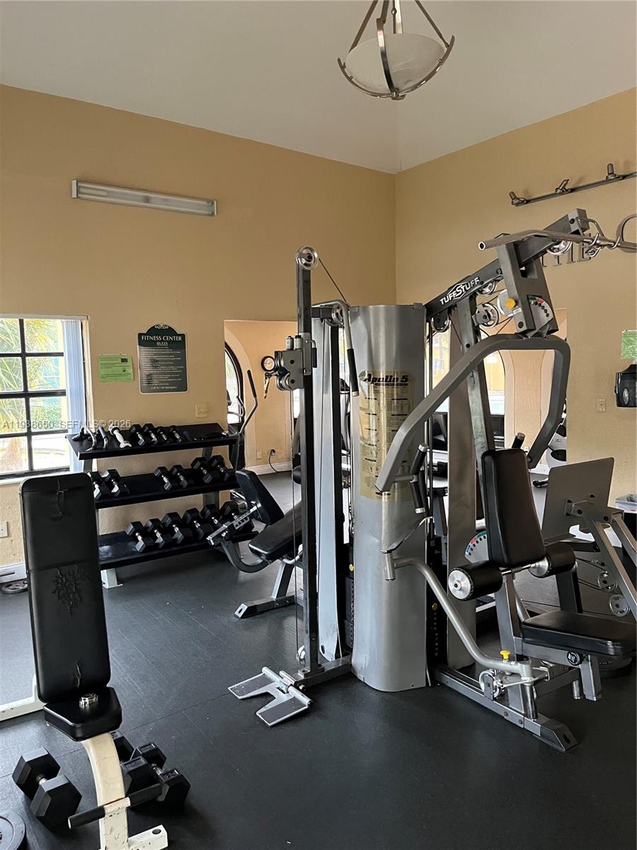 15630 Southwest 80th Street, Unit I110 Miami, FL 33193 - Photo 24 of 28 a room with gym equipment