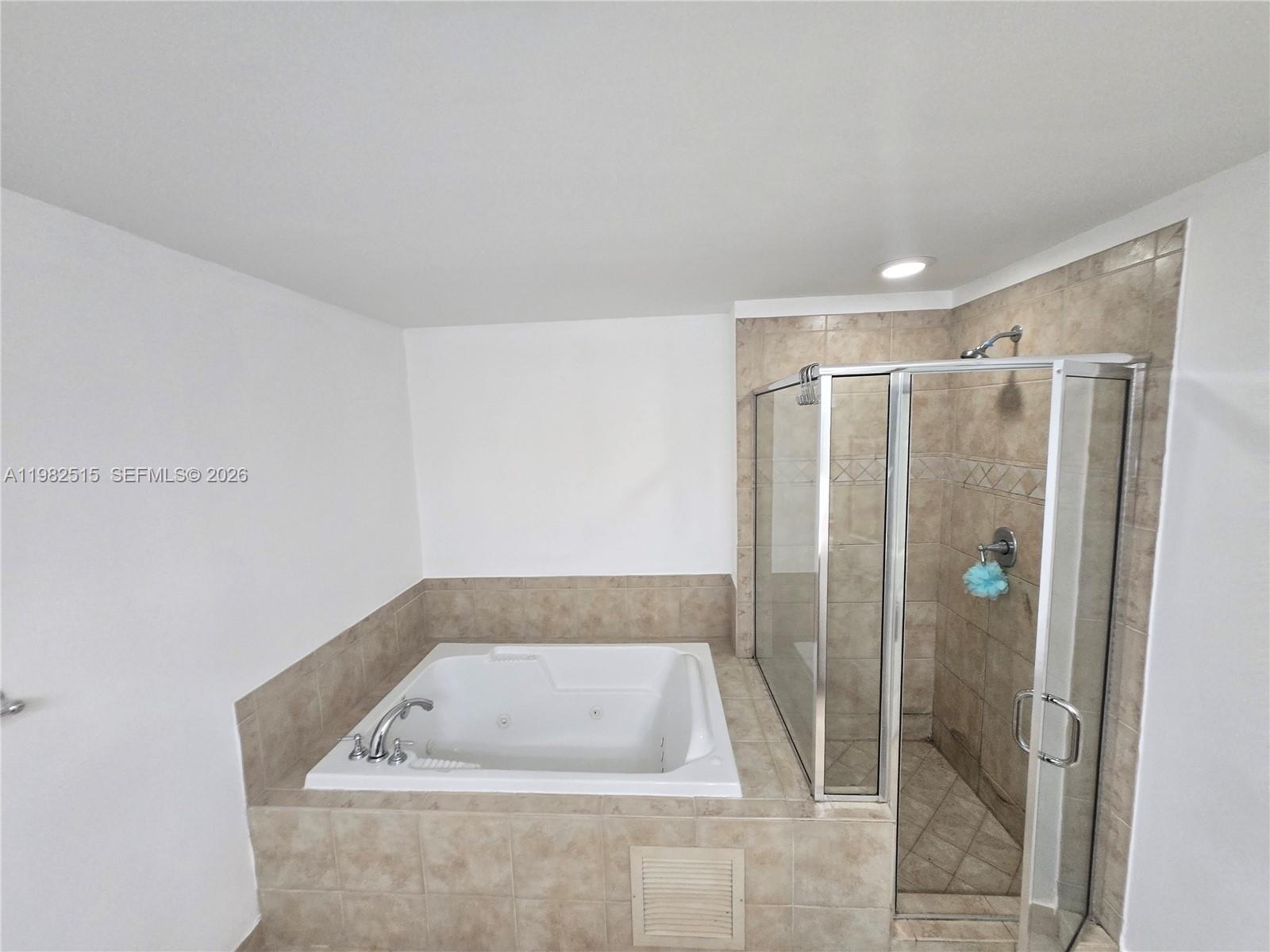 888 Douglas Road, Unit 405 Coral Gables, FL 33134 - Photo 11 of 24 a bathroom with a shower and a sink
