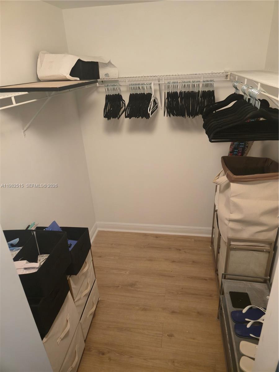888 Douglas Road, Unit 405 Coral Gables, FL 33134 - Photo 11 of 24 Primary Bedroom walk in Closet