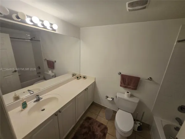 a bathroom with a shower and a toilet