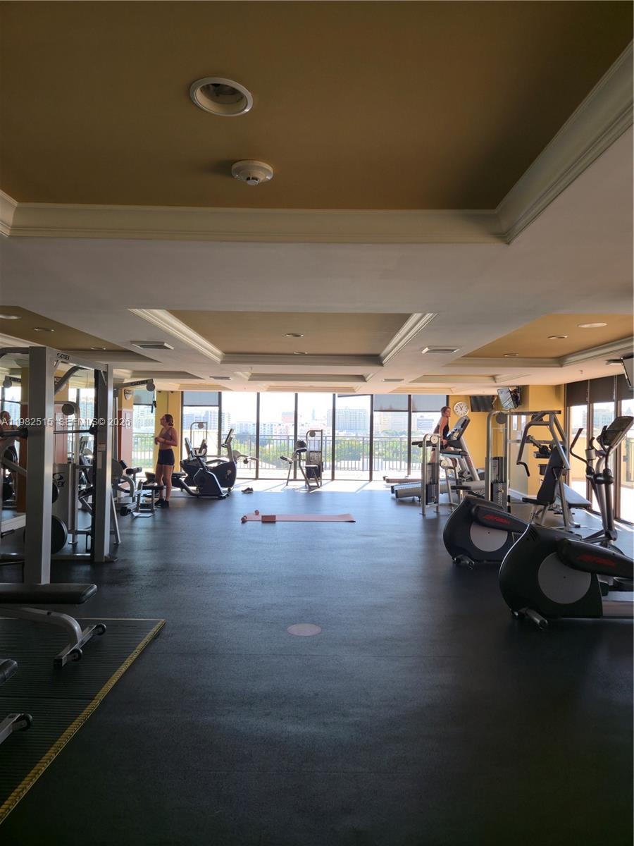 888 Douglas Road, Unit 405 Coral Gables, FL 33134 - Photo 19 of 24 a view of a room with gym equipment
