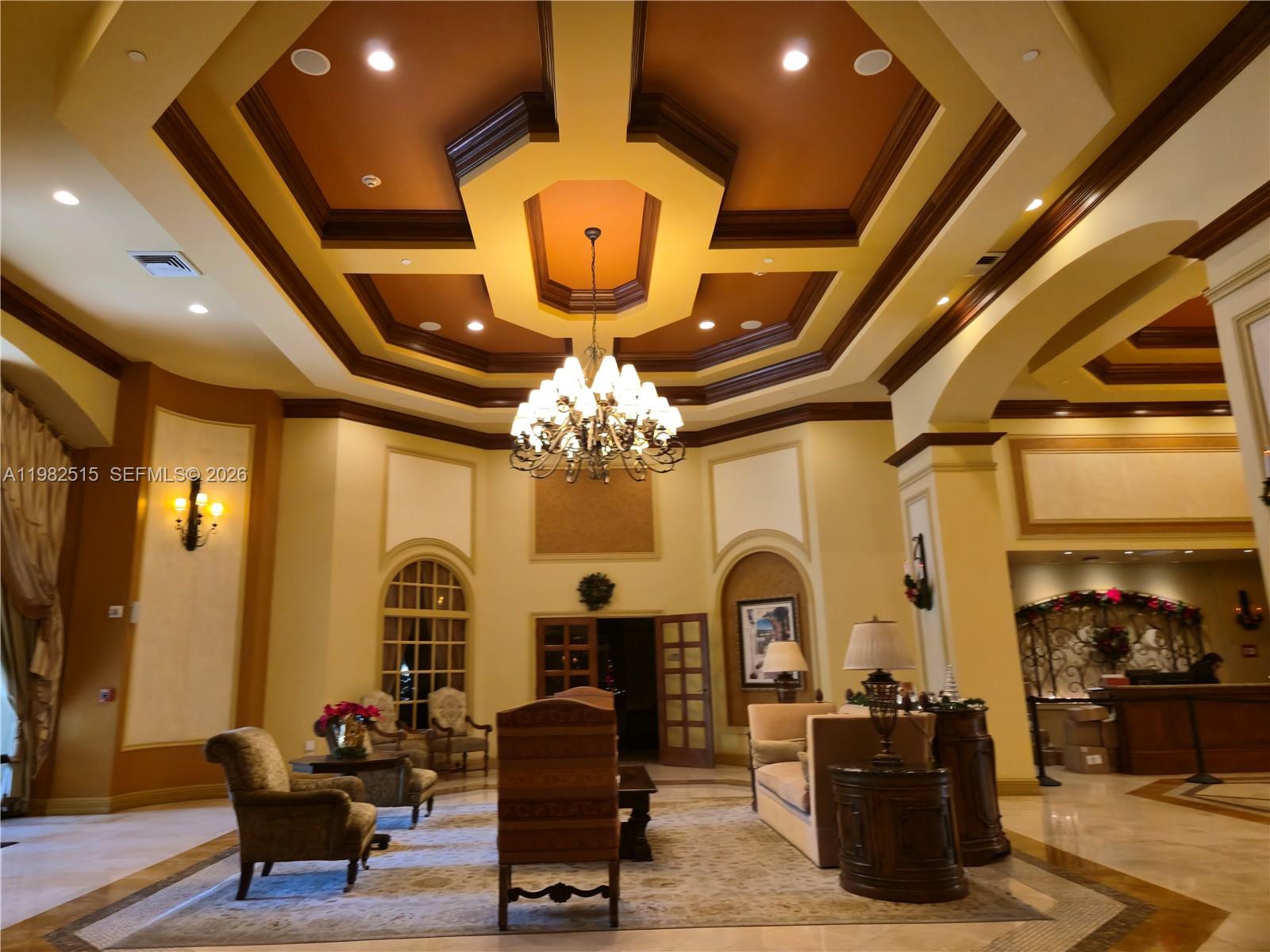 888 Douglas Road, Unit 405 Coral Gables, FL 33134 - Photo 22 of 24 a very nice looking room with many windows and furniture