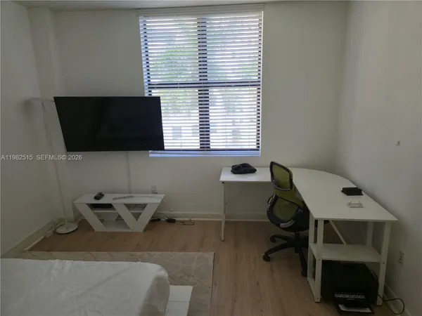 a living room with furniture and a chair