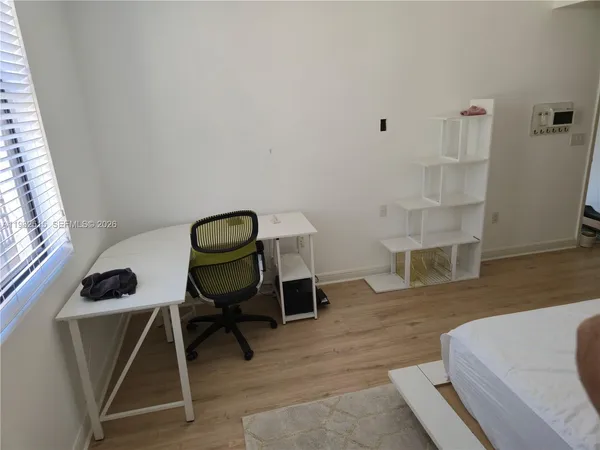 a bathroom with a shower and a sink