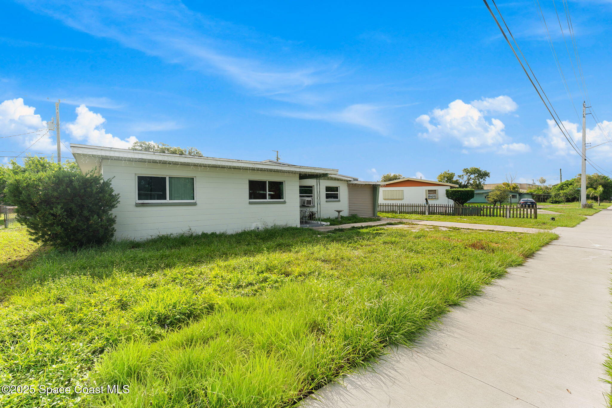 406 North Fiske Boulevard Cocoa, FL 32922 - Photo 16 of 21 a front view of house with yard and green space