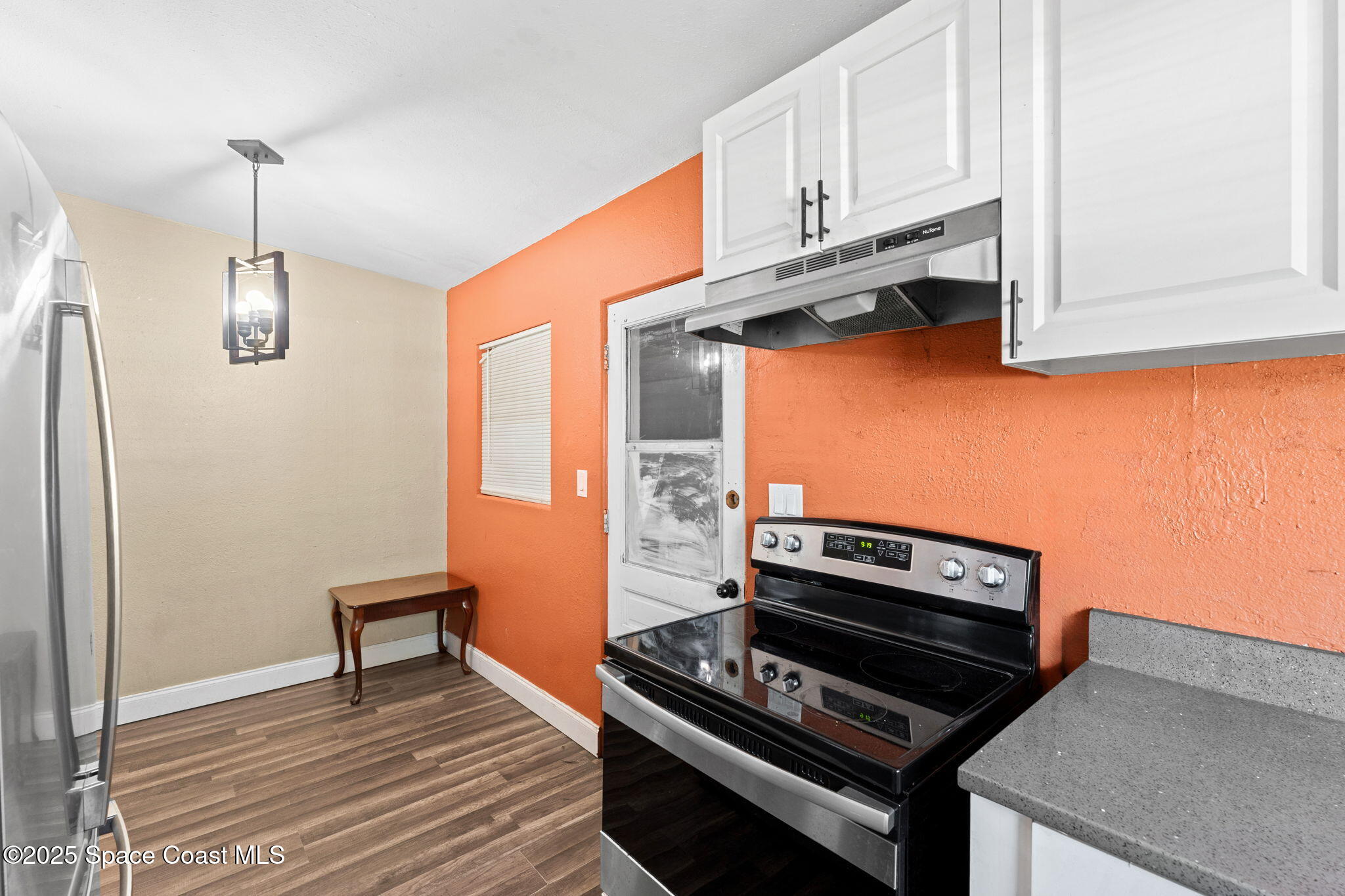 406 North Fiske Boulevard Cocoa, FL 32922 - Photo 8 of 21 a kitchen with stainless steel appliances a stove a sink and cabinets