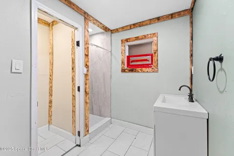 a bathroom with a sink and a mirror