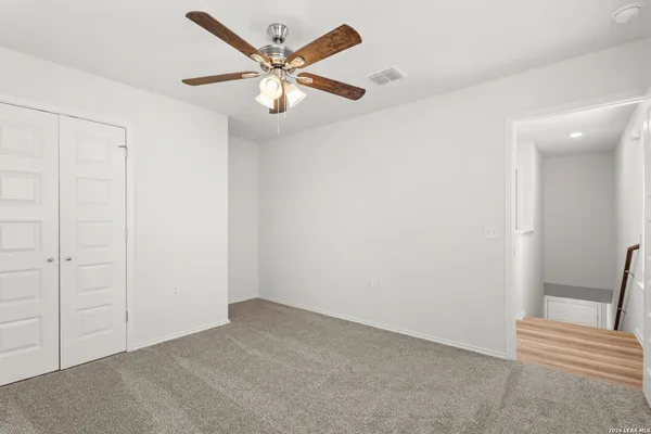 a bathroom with a sink toilet and a mirror