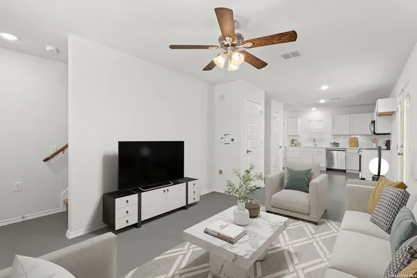 a view of a kitchen with a sink and stainless steel appliances