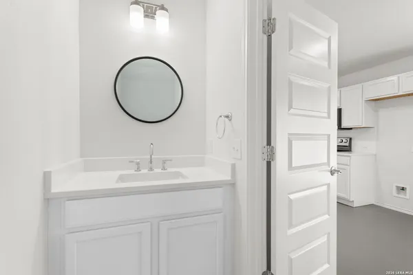 a kitchen with stainless steel appliances white cabinets and a sink