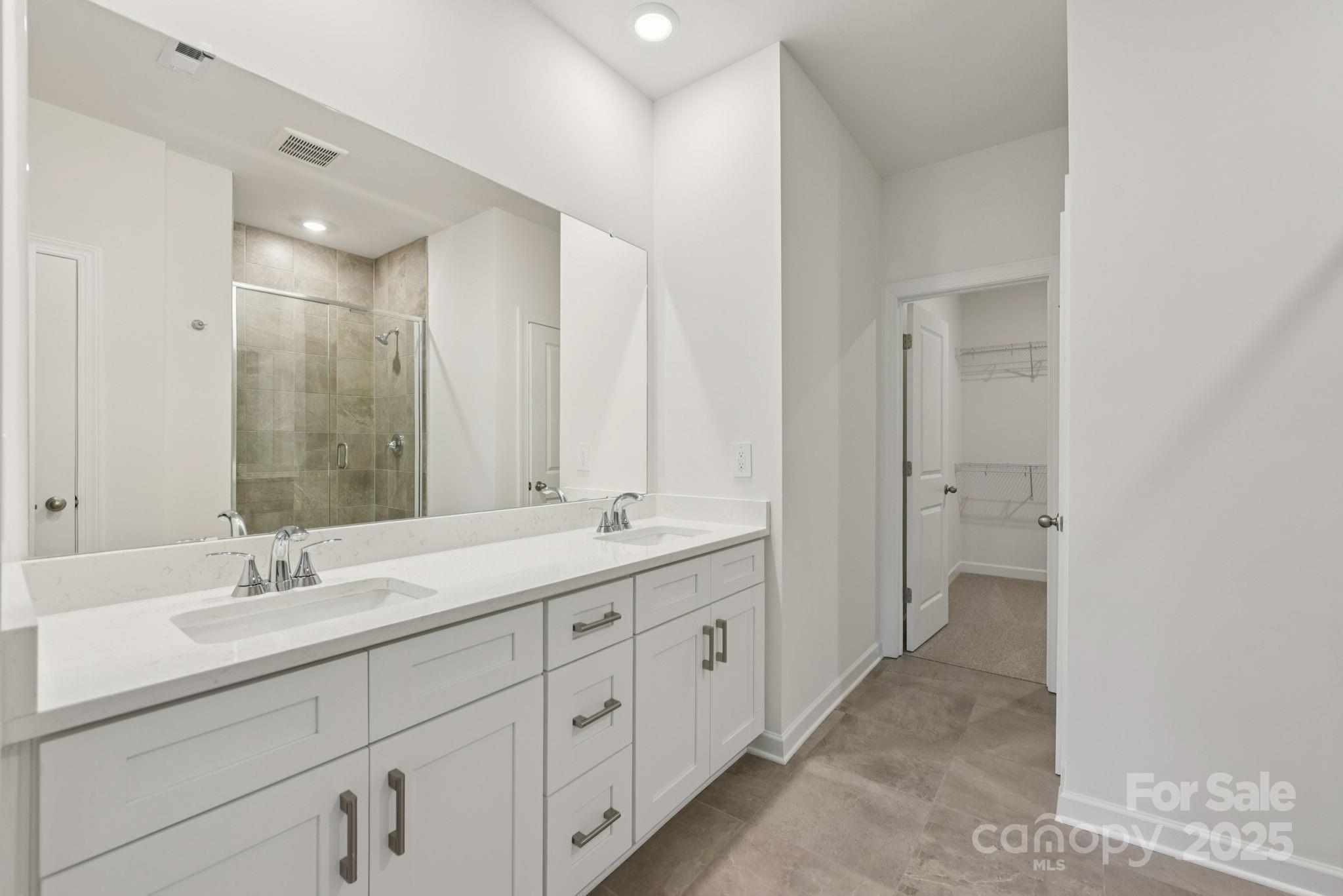 712 Palmer Pendleton Way York, SC 29745 - Photo 19 of 36 a spacious bathroom with a double vanity sink mirror and double