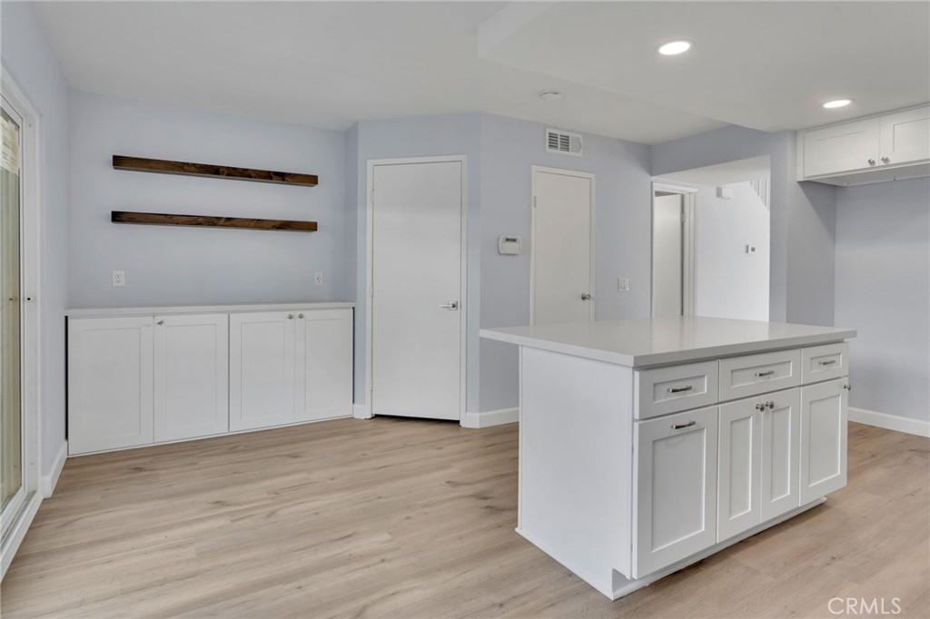 8703 Pine Crest Place Rancho Cucamonga, CA 91730 - Photo 13 of 36 a view of a kitchen with white cabinets