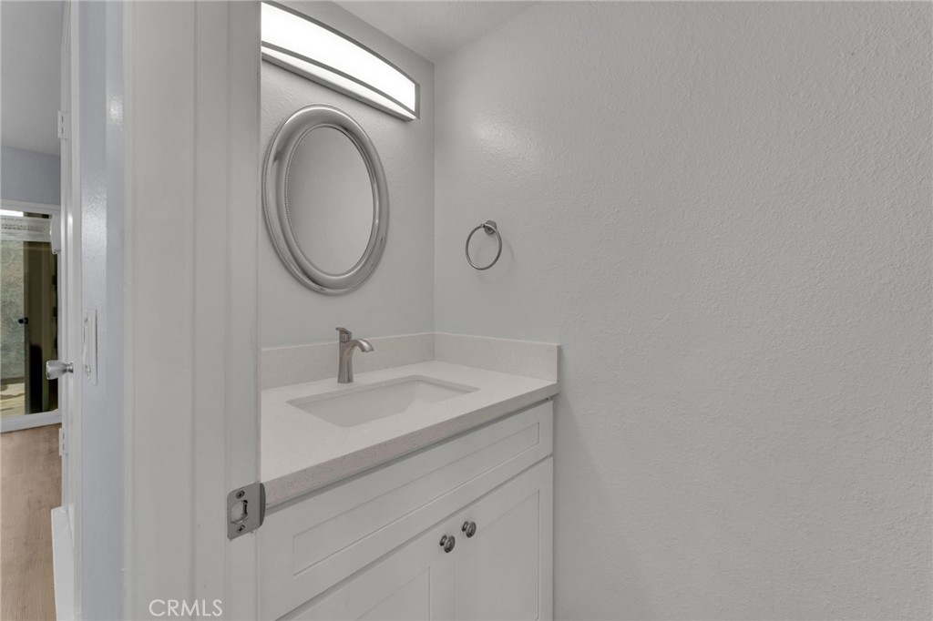 8703 Pine Crest Place Rancho Cucamonga, CA 91730 - Photo 14 of 36 a bathroom with a sink and a mirror